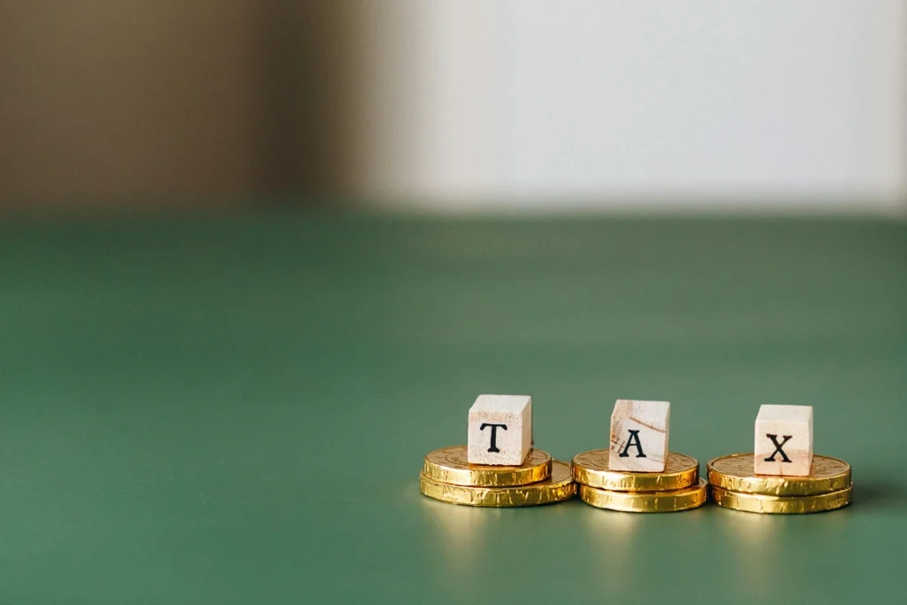 a pile of gold coins with letters