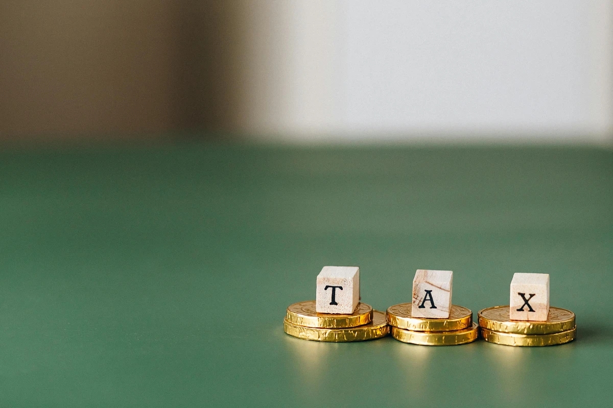 a pile of gold coins with letters