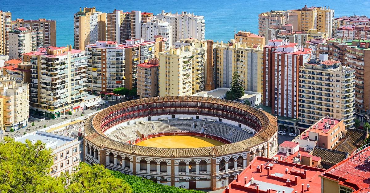 round arena in the background with the city of Malaga