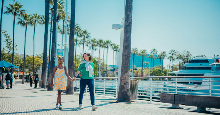 A family stroll along the promenade on a sunny day