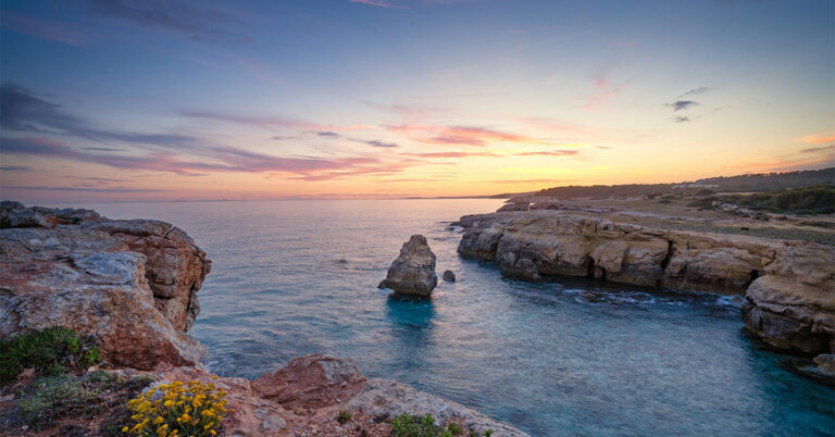 Rock in the sea, sunset