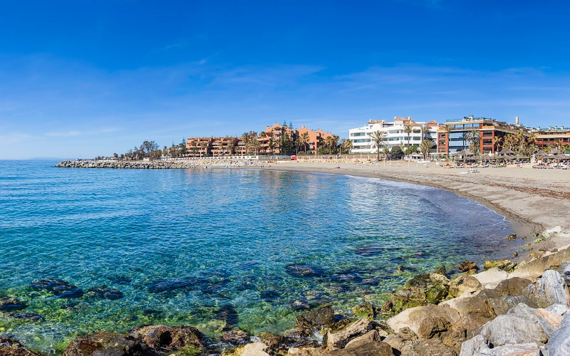 The sea with blocks in the background