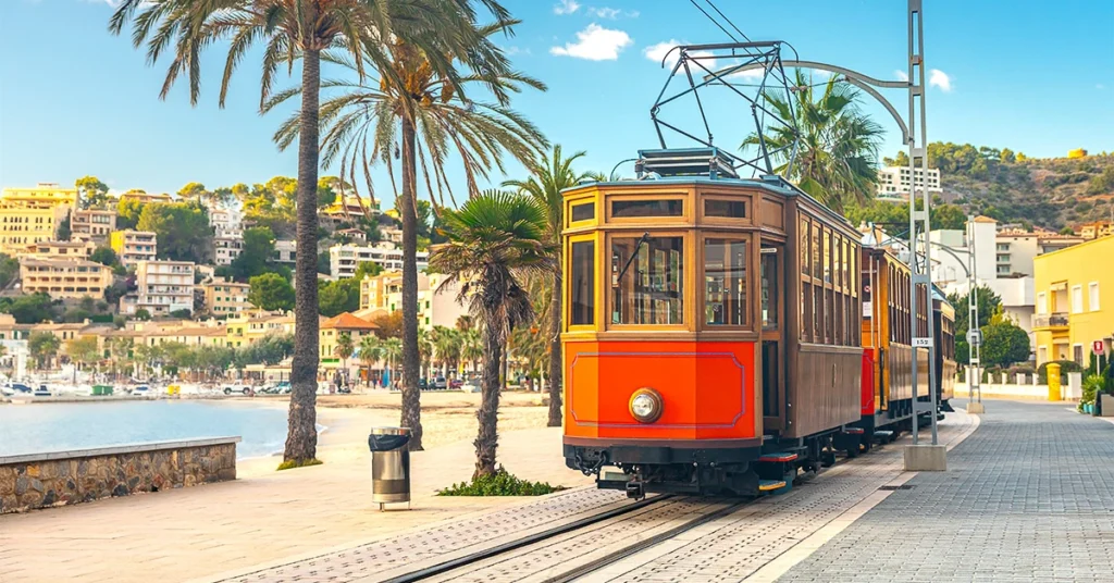 Orange tram against the backdrop of the city